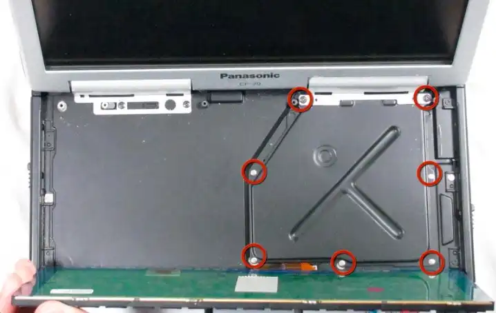 Remove the 7 screws shown from the cover plate